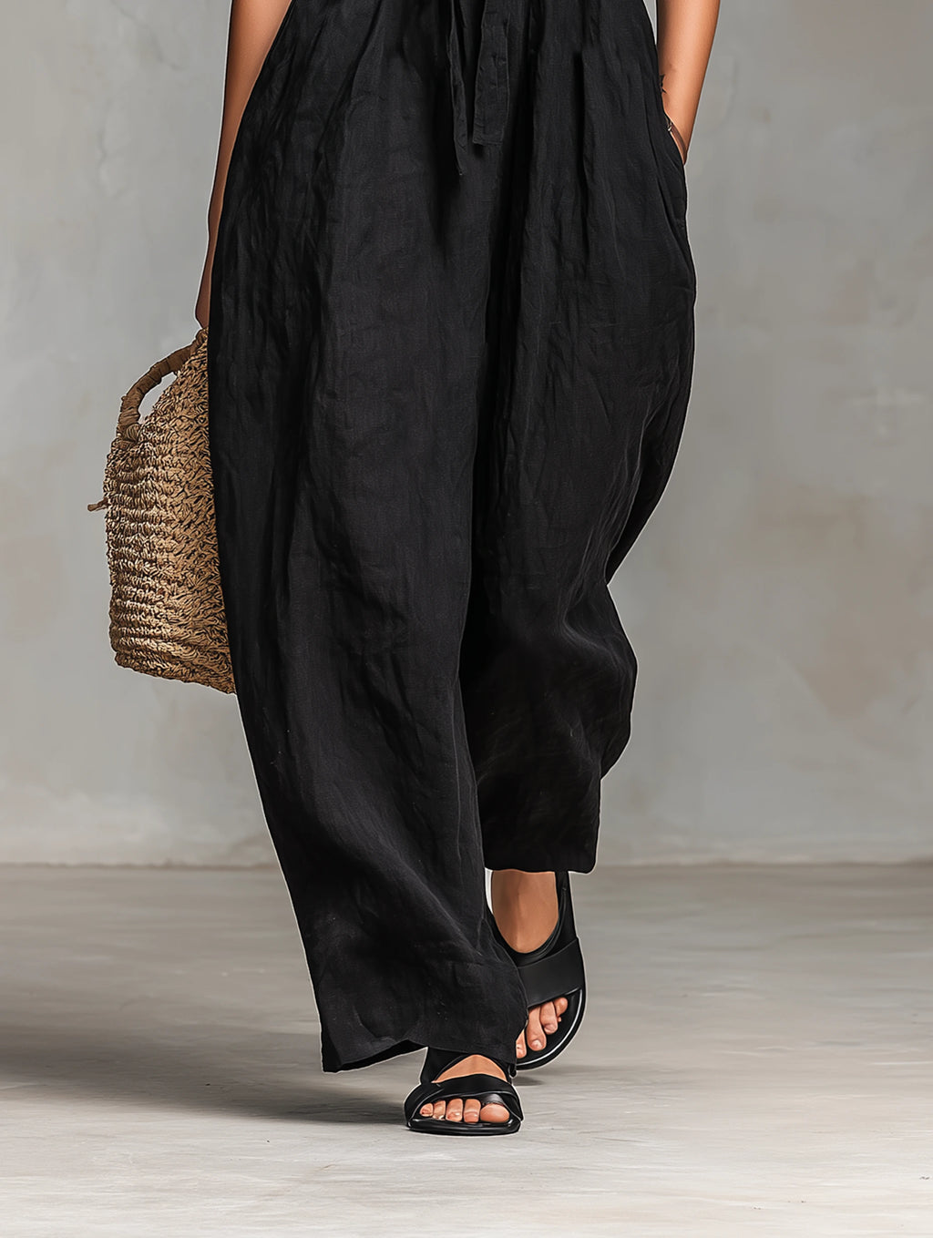 Close-up of a black strapless jumpsuit showing the neckline detail