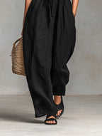 Close-up of a black strapless jumpsuit showing the neckline detail