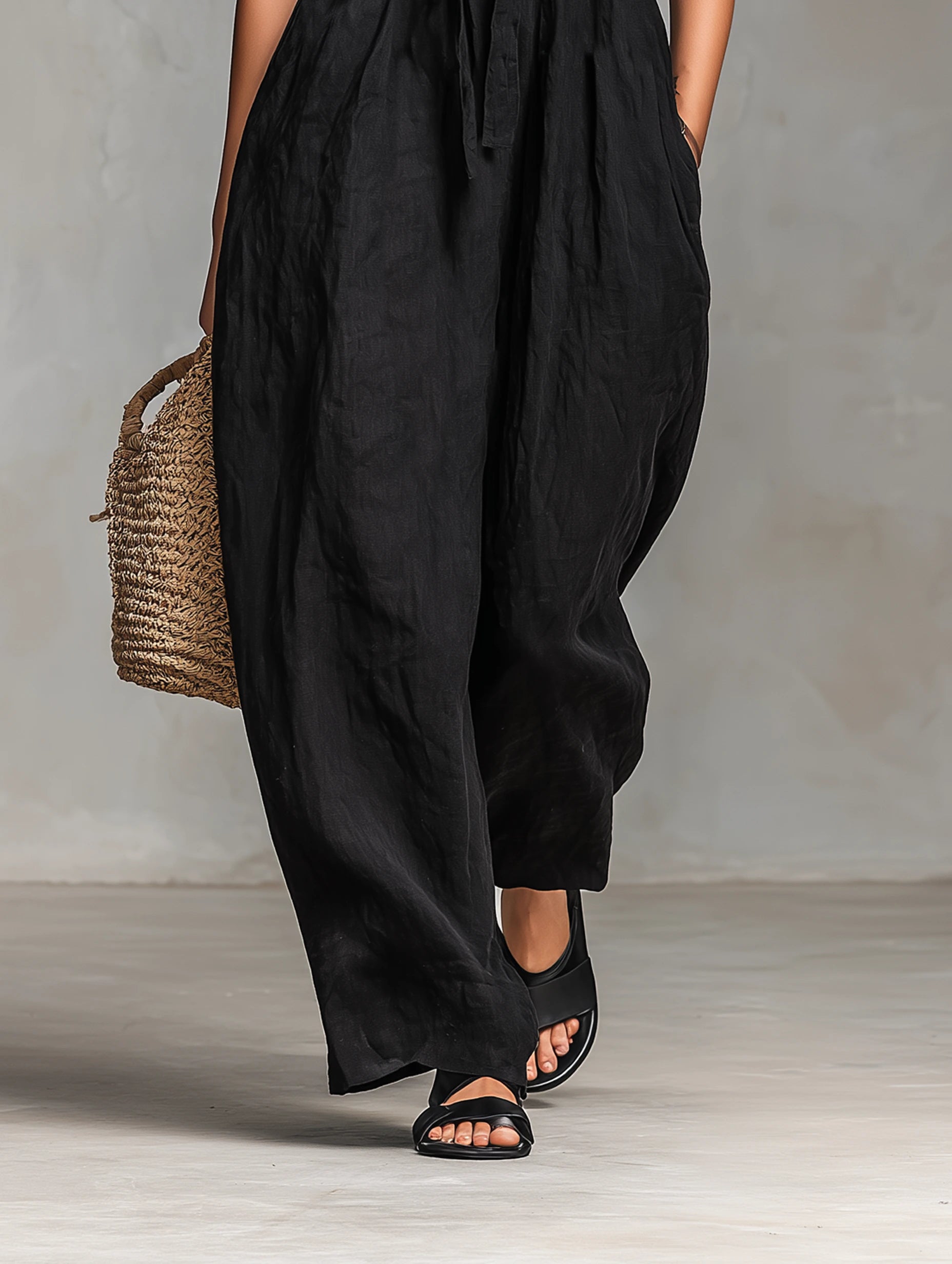 Close-up of a black strapless jumpsuit showing the neckline detail