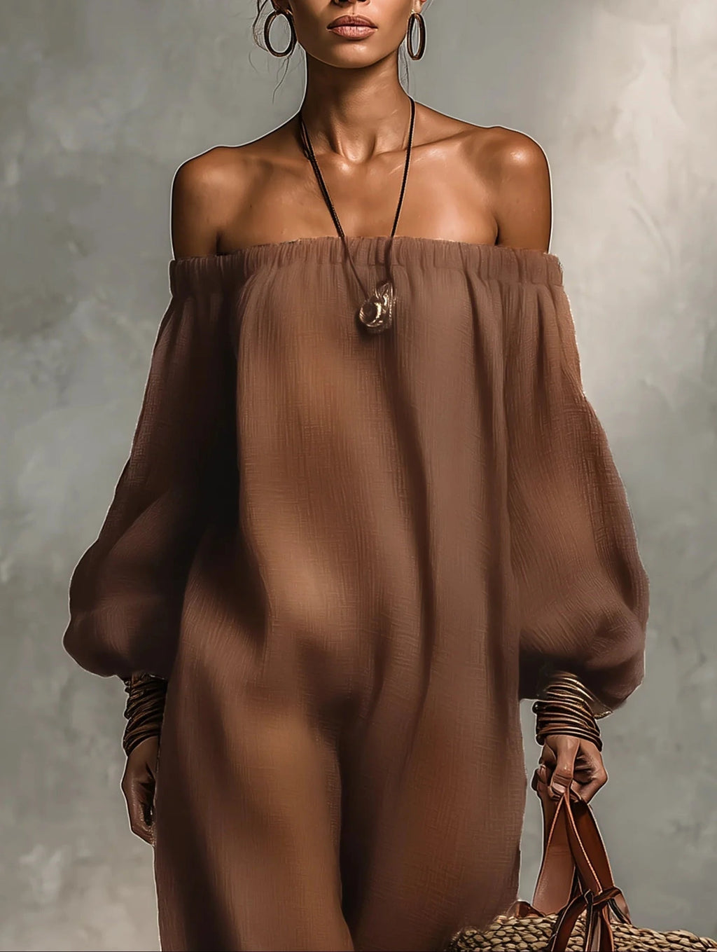 Woman wearing a brown strapless long sleeve jumpsuit in a lifestyle setting