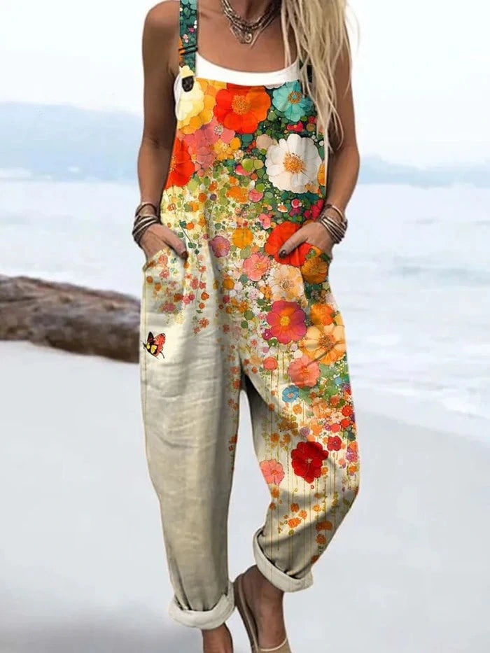 Woman wearing a cream wildflower print jumpsuit, product catalog photo
