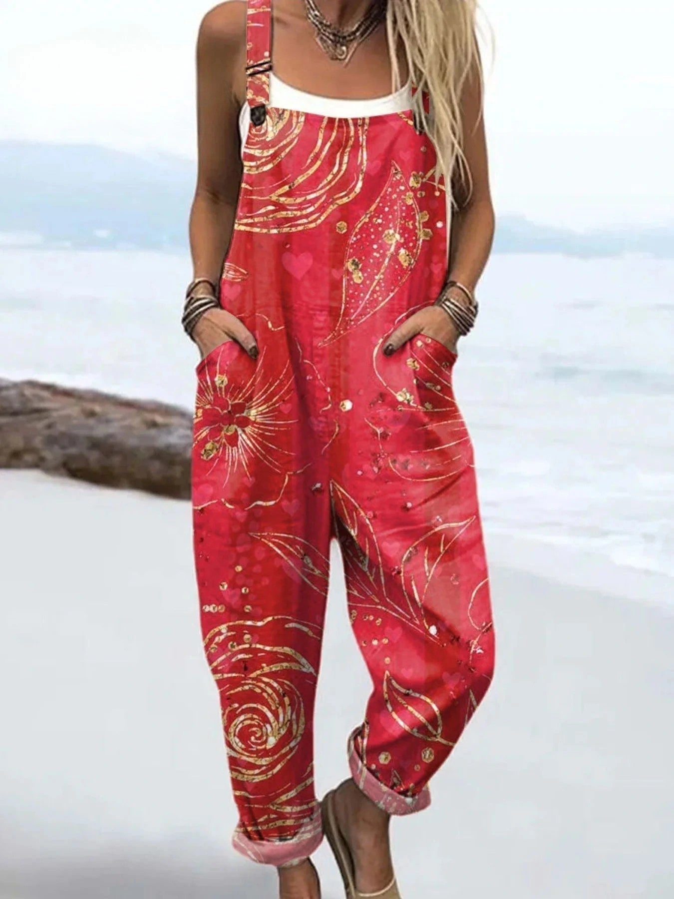 Woman wearing a wildflower print jumpsuit, product catalog photo