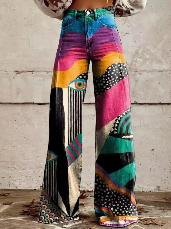 Close-up of multicolor boho chic flared pants with an abstract eye and geometric print