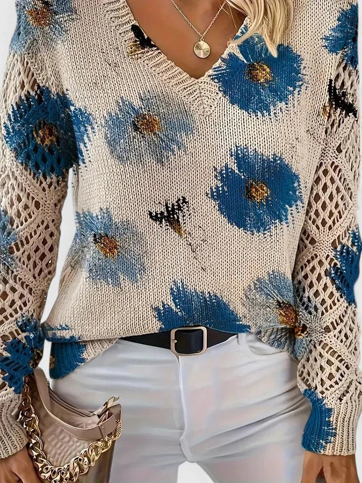 Woman wearing a blue floral v-neck long sleeve sweater in a studio setting, final look