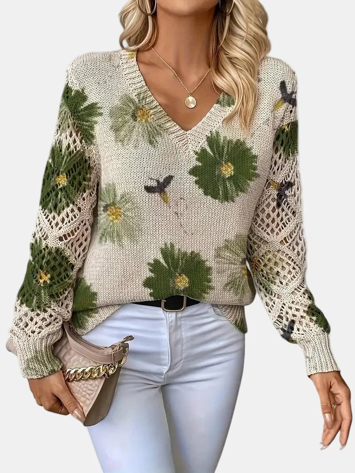 Woman wearing a green floral v-neck long sleeve sweater in a lifestyle setting