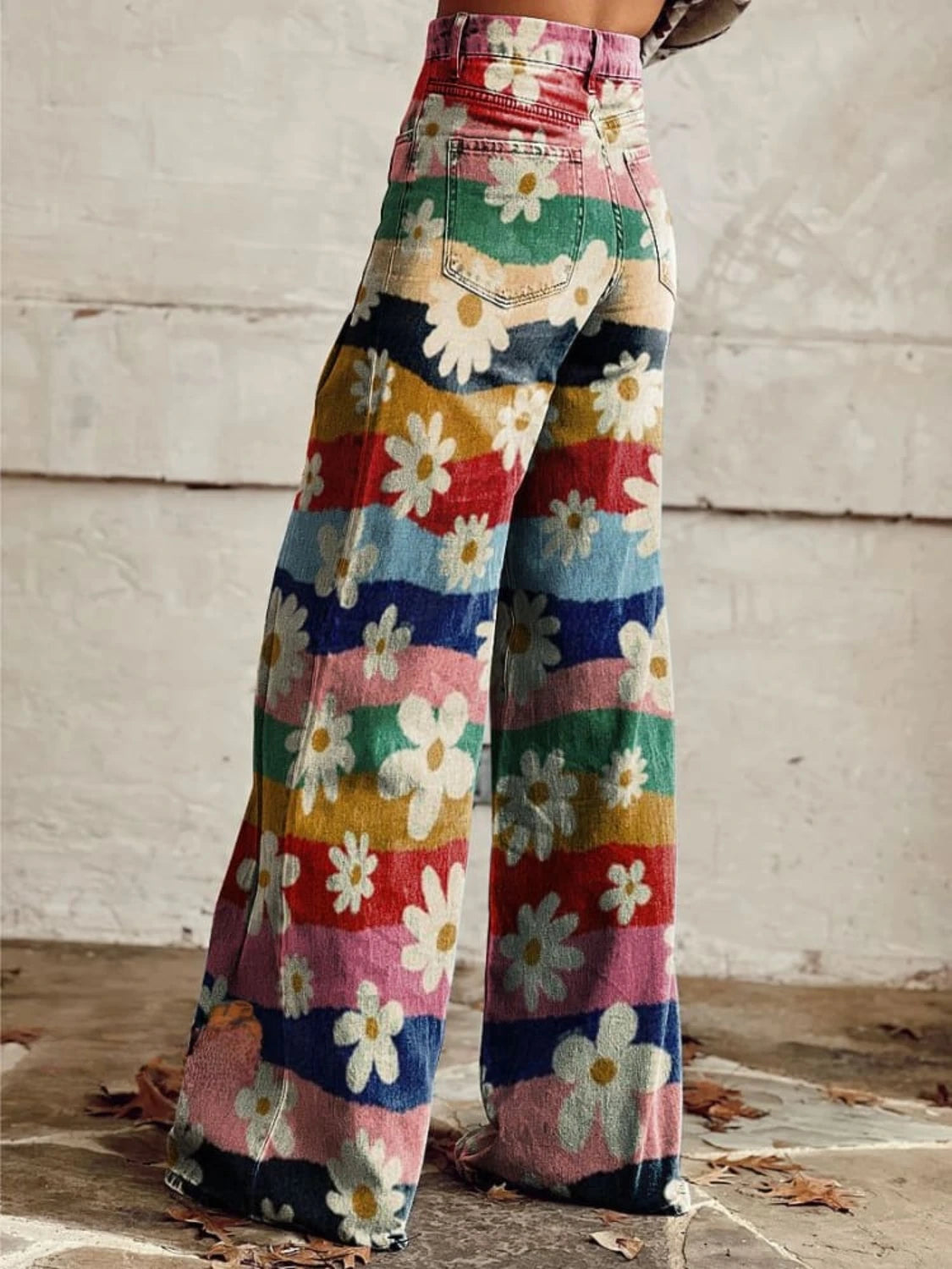 Woman wearing multicolor floral chic wide-leg trousers, back view