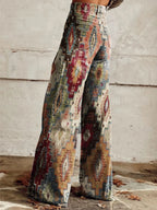 Woman wearing multicolor aztec-print brown vintage chic high-waisted wide-leg trousers, side view