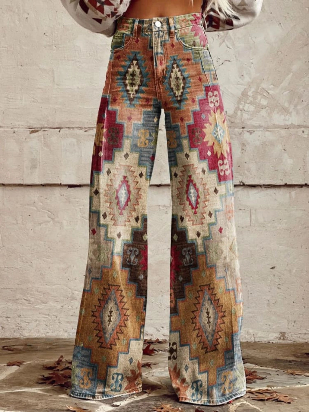 Woman wearing multicolor aztec-print brown vintage chic high-waisted wide-leg trousers, close-up front view
