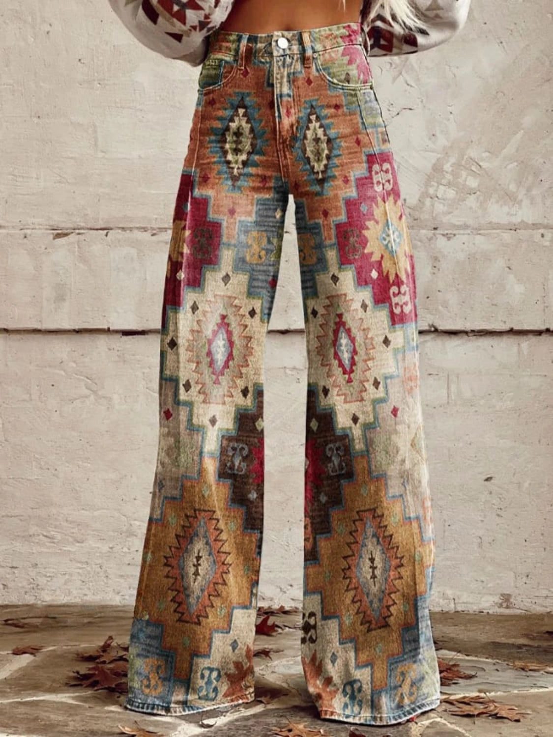Woman wearing multicolor aztec-print brown vintage chic high-waisted wide-leg trousers, close-up front view